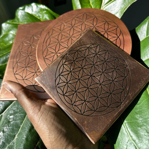 An intricately woven copper grid charging plate, designed to energize and amplify the natural properties of crystals.